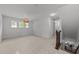 Bright bonus room with neutral carpeting, a cozy light fixture, and many windows for natural light at 904 Pirouette Ct, Raleigh, NC 27606