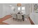 Elegant dining room with seating for six and stylish light fixture at 904 Pirouette Ct, Raleigh, NC 27606
