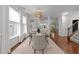 Bright dining room featuring modern chandelier, hardwood floors, and stylish decor at 904 Pirouette Ct, Raleigh, NC 27606