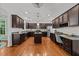 Spacious kitchen with granite countertops, stainless steel appliances, and an island at 904 Pirouette Ct, Raleigh, NC 27606