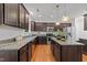 Kitchen featuring granite counters, a kitchen island, and stainless steel appliances at 904 Pirouette Ct, Raleigh, NC 27606