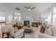 Inviting living room with fireplace, ceiling fan, and comfortable furniture at 904 Pirouette Ct, Raleigh, NC 27606