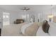 Spacious primary bedroom features neutral walls, plush carpeting, a ceiling fan, and lots of natural light at 904 Pirouette Ct, Raleigh, NC 27606