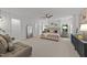 Spacious primary bedroom features neutral walls, plush carpeting, a ceiling fan, and lots of natural light at 904 Pirouette Ct, Raleigh, NC 27606