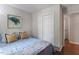 Bedroom with blue bedding, hardwood floors, closet and doorway at 1 Old Towne Pl, Durham, NC 27713