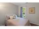 Cozy bedroom featuring a comfortable bed, window view, and stylish decor at 1 Old Towne Pl, Durham, NC 27713