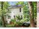 Back exterior view of home featuring a deck and mature trees at 1 Old Towne Pl, Durham, NC 27713