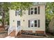 Attractive two-story home with a welcoming front porch and grey shutters at 1 Old Towne Pl, Durham, NC 27713