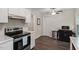 Modern kitchen featuring sleek appliances, marble countertops, and ample cabinet space at 1 Old Towne Pl, Durham, NC 27713