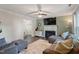 Inviting living room with a fireplace, ceiling fan, hardwood flooring, and cozy furniture at 1 Old Towne Pl, Durham, NC 27713