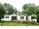 Charming single-story home with modern updates and beautifully landscaped front yard at 100 Eastwood Lake Rd Rd, Chapel Hill, NC 27514