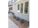 Exterior view showcasing modern design, manicured landscaping, and stylish potted plants near entrance at 100 Eastwood Lake Rd Rd, Chapel Hill, NC 27514