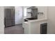 Modern kitchen with stainless steel appliances, white cabinetry, and a sleek countertop at 100 Eastwood Lake Rd Rd, Chapel Hill, NC 27514