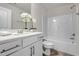 Bright bathroom featuring a tub with shower, vanity, toilet and tiled floor at 1007 Sora Way, Durham, NC 27703