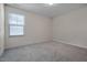 Clean, carpeted bedroom with natural light, and neutral paint at 1007 Sora Way, Durham, NC 27703