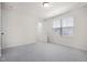 Empty carpeted bedroom with a large window, offering natural light at 1007 Sora Way, Durham, NC 27703