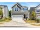 Charming two-story home with a well-manicured front yard and two car garage at 1007 Sora Way, Durham, NC 27703