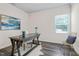 Bright home office with stylish desk, decor, and a large window at 1007 Sora Way, Durham, NC 27703