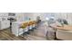 Modern kitchen featuring an island with bar seating and stainless steel appliances at 1007 Sora Way, Durham, NC 27703
