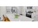 Well-equipped kitchen featuring a large island with quartz countertops and modern appliances at 1007 Sora Way, Durham, NC 27703