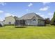 Expansive backyard featuring a trampoline, lush green lawn, and a well-maintained fence at 101 Hazel Ln Ln, Broadway, NC 27505