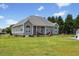 Large backyard with a hammock, swingset, above ground pool, and mature trees at 101 Hazel Ln Ln, Broadway, NC 27505