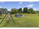 Large backyard with mature trees and an above ground pool with a ladder at 101 Hazel Ln Ln, Broadway, NC 27505