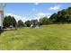 Large backyard showcasing an above ground pool, a trampoline, shed and mature trees at 101 Hazel Ln Ln, Broadway, NC 27505