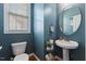 Powder room features pedestal sink, wood floors, and lovely natural light at 101 Hazel Ln Ln, Broadway, NC 27505