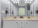 Bathroom with a double sink with chrome fixtures and a large mirror at 101 Hazel Ln Ln, Broadway, NC 27505
