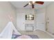 bedroom with grey carpet, ceiling fan, and monkey wall art at 101 Hazel Ln Ln, Broadway, NC 27505