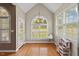 Charming breakfast nook with hardwood floors, a large window, and a door to the outside at 101 Hazel Ln Ln, Broadway, NC 27505