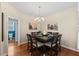 Dining room with hardwood floors, modern chandelier and seating for eight at 101 Hazel Ln Ln, Broadway, NC 27505