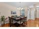 Dining room with hardwood floors, modern chandelier and seating for eight at 101 Hazel Ln Ln, Broadway, NC 27505