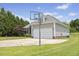 View of a spacious driveway and backyard with basketball hoop at 101 Hazel Ln Ln, Broadway, NC 27505