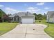 View of a spacious driveway and backyard with basketball hoop at 101 Hazel Ln Ln, Broadway, NC 27505
