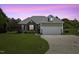 Charming single Gathering home featuring a two-car garage and landscaped front yard at 101 Hazel Ln Ln, Broadway, NC 27505