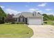 Charming single Gathering home featuring a two-car garage and landscaped front yard at 101 Hazel Ln Ln, Broadway, NC 27505