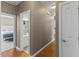Hallway with hardwood flooring leading to a bathroom and bedroom at 101 Hazel Ln Ln, Broadway, NC 27505