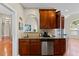 Kitchen area featuring a dishwasher, cherry cabinets, granite countertops, and stainless steel appliances at 101 Hazel Ln Ln, Broadway, NC 27505