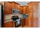 Stylish kitchen with stainless steel appliances, granite countertops, and custom cherry cabinets at 101 Hazel Ln Ln, Broadway, NC 27505