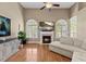 Bright living room featuring a fireplace, large windows, and hardwood floors at 101 Hazel Ln Ln, Broadway, NC 27505