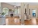 Bright living room featuring a fireplace, large windows, and hardwood floors at 101 Hazel Ln Ln, Broadway, NC 27505
