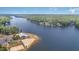 Panoramic aerial perspective of the community's lake, beachfront, and clubhouse at 1033 Sagamore Dr, Louisburg, NC 27549
