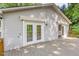 Wooden back porch featuring a set of French doors and awning at 1033 Sagamore Dr, Louisburg, NC 27549