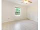Comfortable bedroom with neutral tones, a ceiling fan, and great natural light from the window at 1033 Sagamore Dr, Louisburg, NC 27549