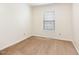 Cozy bedroom featuring neutral carpet, paint, and trim for a relaxing atmosphere at 1033 Sagamore Dr, Louisburg, NC 27549