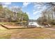 Picturesque boat docks with several boats moored on a tranquil lake surrounded by lush trees at 1033 Sagamore Dr, Louisburg, NC 27549