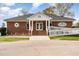Clubhouse featuring a brick facade with white columns and a welcoming entrance ramp at 1033 Sagamore Dr, Louisburg, NC 27549
