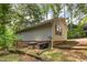 Exterior side view of a home featuring HVAC units and mature trees at 1033 Sagamore Dr, Louisburg, NC 27549